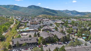 Aerial overview of property's location featuring a mountain backdrop and nearby area