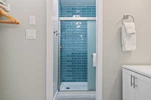 Full bathroom featuring floor to ceiling tile