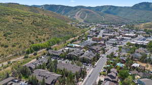 Aerial view of property's location featuring mountains and nearby area