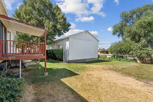 View of yard featuring a wooden deck