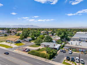 Aerial view of residential area featuring a mountainous background