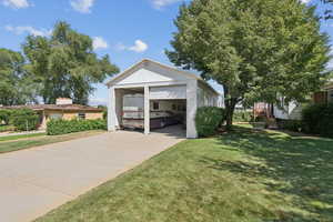 Detached garage with concrete driveway