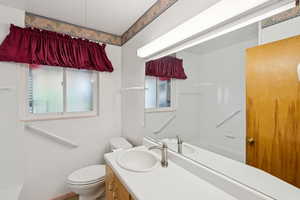 Full bathroom with vanity and toilet