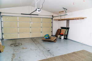 Garage featuring a garage door opener