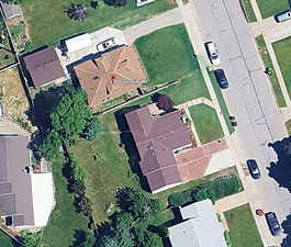 View of property location with nearby suburban area