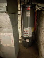 Utility room with heating unit and gas water heater