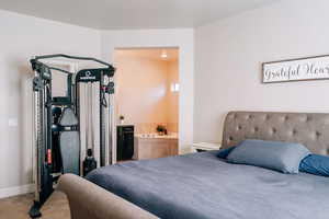 Bedroom featuring carpet floors and connected bathroom