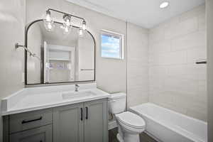 Bathroom featuring vanity and bathing tub / shower combination