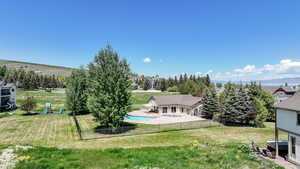 Fenced backyard with a patio