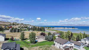 Aerial perspective of suburban area with a nearby body of water