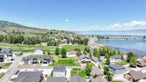 Aerial perspective of suburban area featuring a water and mountain view