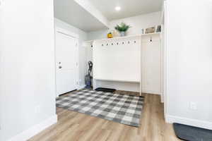 Mudroom with light wood finished floors