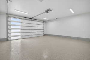 Garage featuring a garage door opener