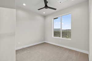 Downstairs ADU. Spare room with light colored carpet, ceiling fan, and recessed lighting