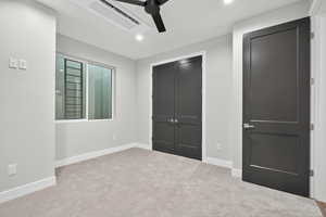 Unfurnished bedroom with carpet, recessed lighting, a closet, and ceiling fan