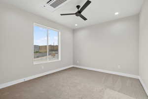 Downstairs ADU. Bedroom featuring light colored carpet, recessed lighting, and ceiling fan