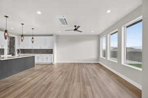 Downstairs ADU. Unfurnished living room with light wood-style floors, a ceiling fan, and recessed lighting