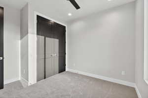 Downstairs ADU. Unfurnished bedroom with a closet, carpet, recessed lighting, and a ceiling fan