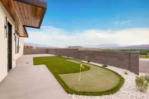 Downstairs ADU. Fenced backyard with a putting green and a mountain view