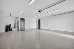 Downstairs ADU. Garage with secured water heater and a garage door opener