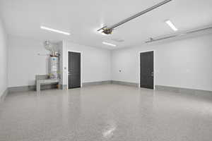 Garage with water heater and a garage door opener