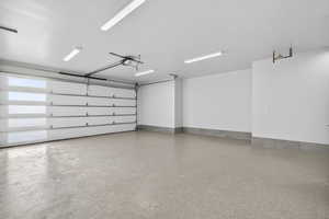 Downstairs ADU. Garage featuring baseboards