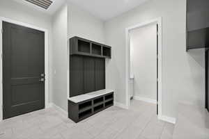 Mudroom featuring baseboards