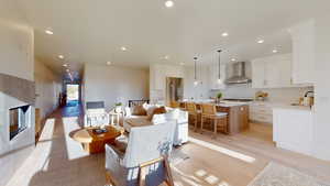 Living room with recessed lighting and light wood finished floors