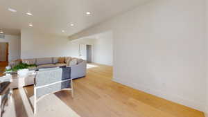 Living room featuring recessed lighting and light wood-type flooring