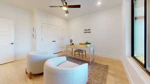 Office area with light wood-style flooring, recessed lighting, and ceiling fan