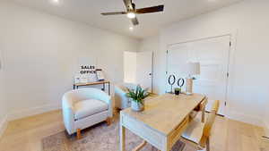 Office with light wood-style floors, recessed lighting, and a ceiling fan