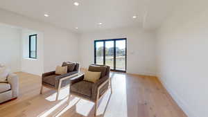 Sitting room featuring recessed lighting and light wood-style flooring