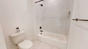 Bathroom with washtub / shower combination and toilet