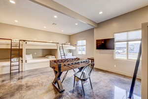 Game room featuring concrete floors and recessed lighting