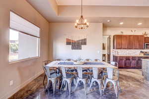 Dining space featuring a chandelier and recessed lighting