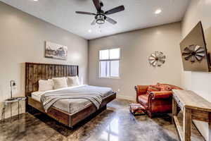 Bedroom featuring concrete floors, ceiling fan, and recessed lighting