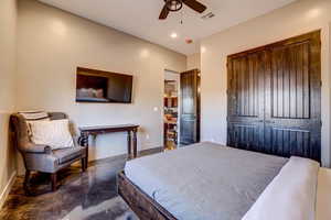 Bedroom featuring concrete flooring, a closet, recessed lighting, and ceiling fan