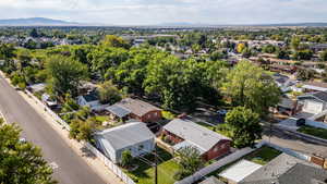 Aerial perspective of suburban area with a mountain backdrop