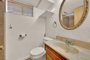 Bathroom with vanity and a shower