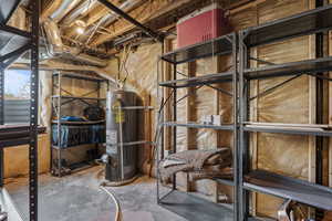 Unfinished basement with strapped water heater