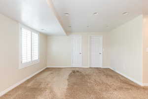 Spare room with carpet and recessed lighting