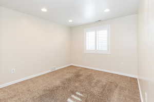 Unfurnished room featuring carpet floors and recessed lighting