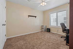 Office space featuring carpet floors and ceiling fan