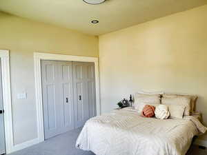 Bedroom with carpet floors and a closet
