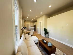 Living area featuring recessed lighting and light wood-type flooring