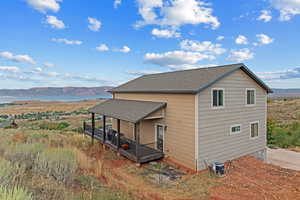 View of home's exterior featuring a mountain view and roof with shingles