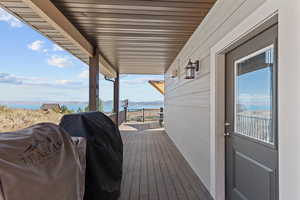 Deck featuring grilling area and a water view