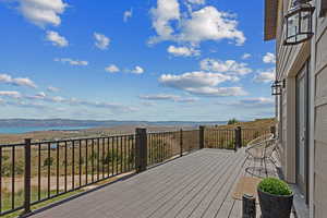 Deck featuring a water and mountain view