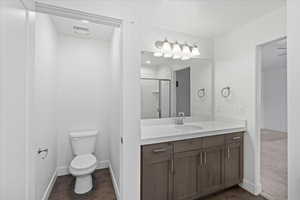 Bathroom featuring vanity and a shower stall