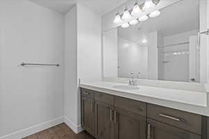 Bathroom with vanity and dark wood-type flooring